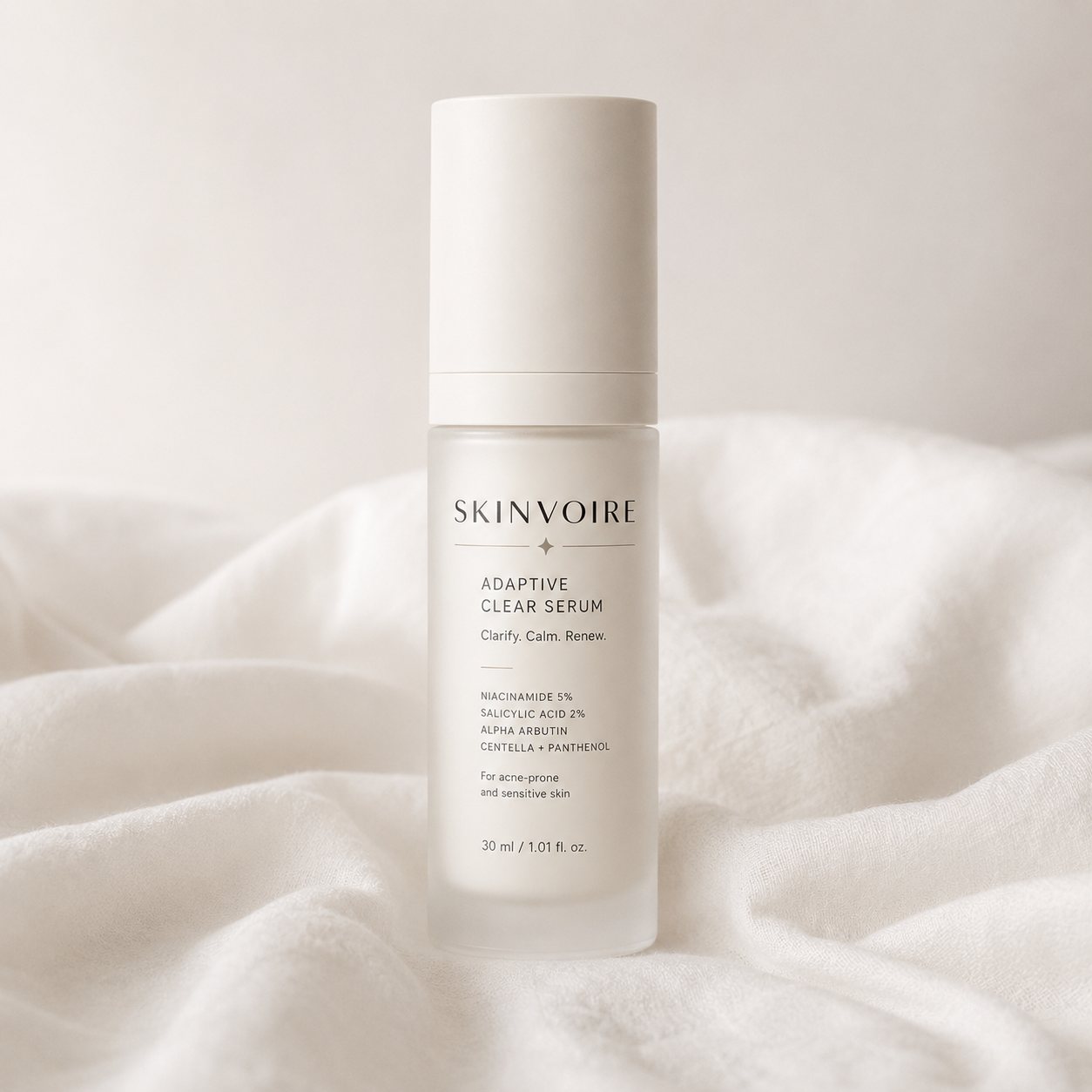 SKINVOIRE Adaptive Clear Serum bottle on soft linen